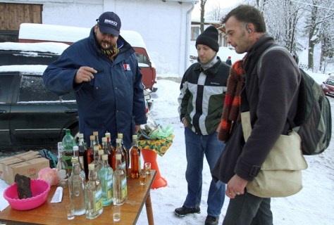 SERBIA: A tourist talks with a Serbian selling homemade brandy at the foot of Mount Rtanj. Visitors have flocked to the mountain in south-eastern Serbia because its pyramidal shape apparently gives Rtanj 'mystical powers', allowing it to survive the apocalypse