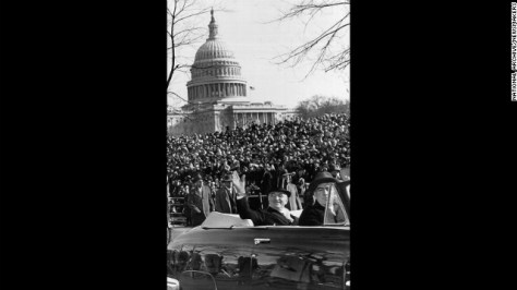 President Harry S. Truman waves to the crowd from a car during a parade after his inauguration speech on January 20, 1949