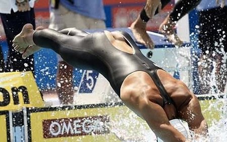 American Olympian swimmer Ricky Berens split em suit while diving into the pool during a meet in 2012