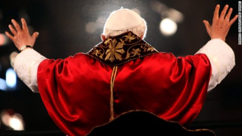 Benedict waves to the crowd gathered at the Colosseum in Rome during the Way of the Cross procession on Good Friday in April 2012.