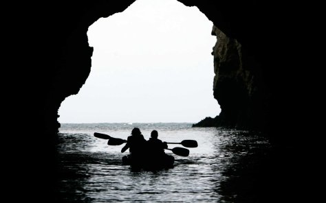 A couple with the Channel Islands Whale Expedition group kayak through Painted Cave at Santa Cruz I